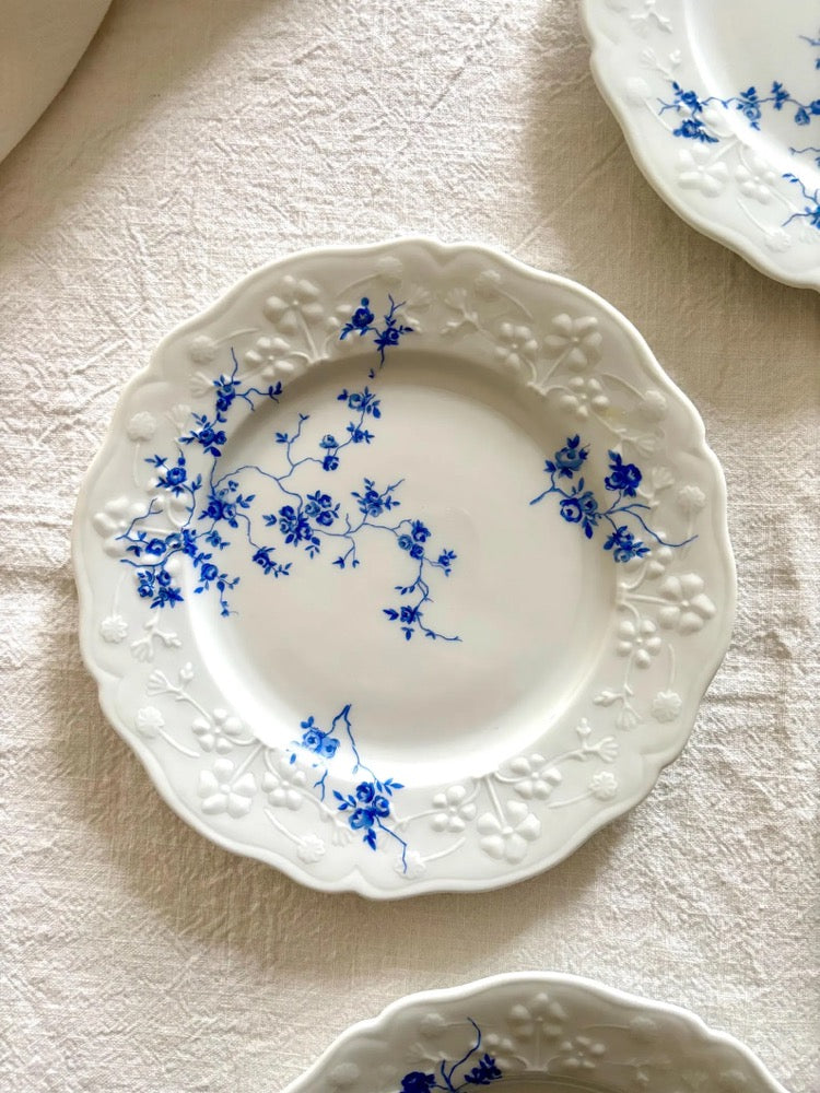 Set of 6 vintage porcelain dessert plates with raised blue floral motifs on a white background, Sologne Porcelain