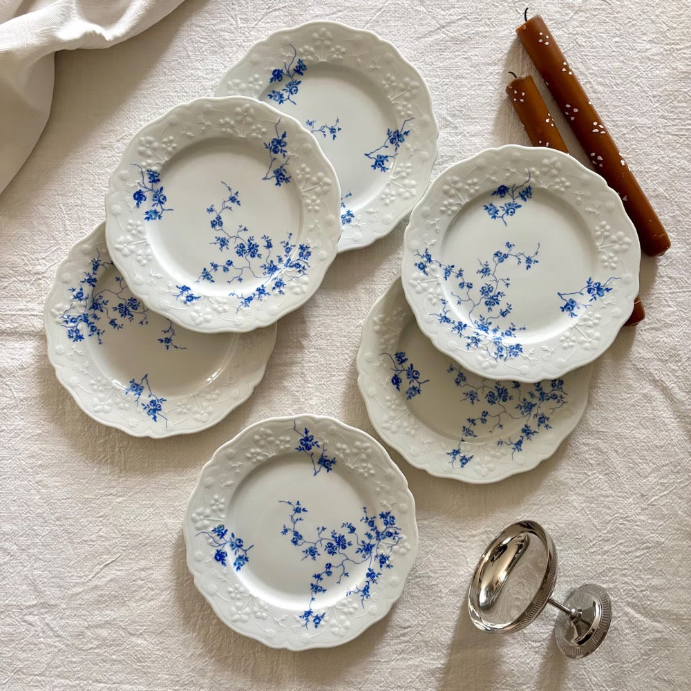 Set of 6 vintage porcelain dessert plates with raised blue floral motifs on a white background, Sologne Porcelain