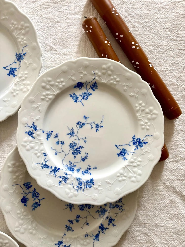 Set of 6 vintage porcelain dessert plates with raised blue floral motifs on a white background, Sologne Porcelain