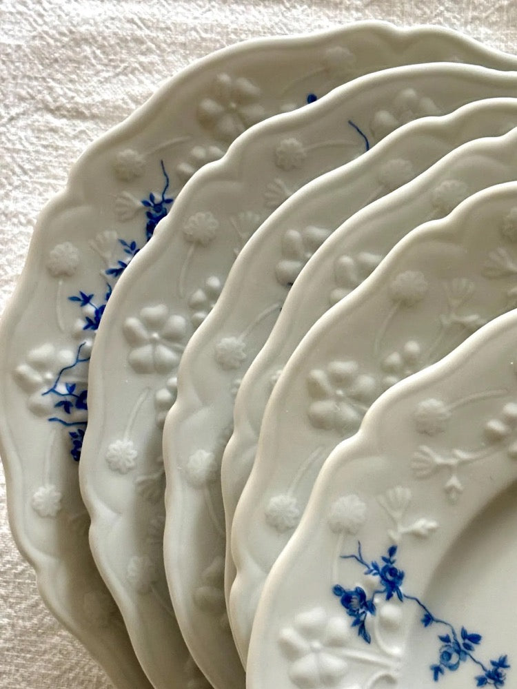 Set of 6 vintage porcelain dessert plates with raised blue floral motifs on a white background, Sologne Porcelain